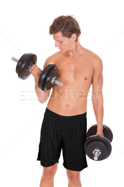 Man Exercising With Dumbbells Stock photo © AndreyPopov