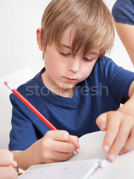 Young boy doing homework Stock photo © AndreyPopov