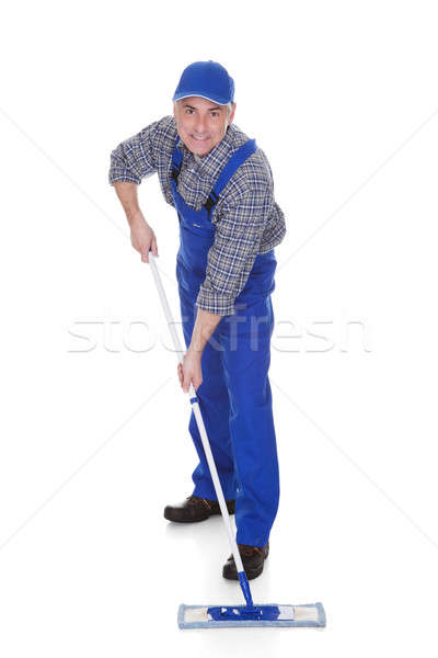 Mature Man Cleaning Floor With Mop Stock photo © AndreyPopov