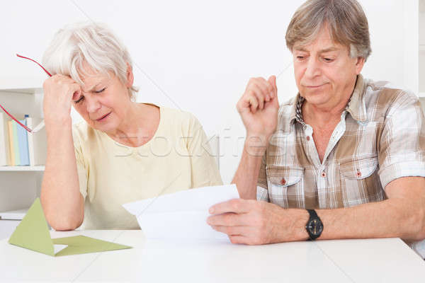 Upset Senior Couple With Letter Stock photo © AndreyPopov