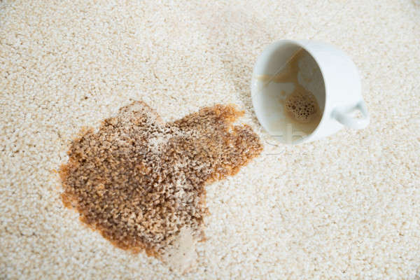 Coffee Spilling From Cup On Carpet Stock photo © AndreyPopov