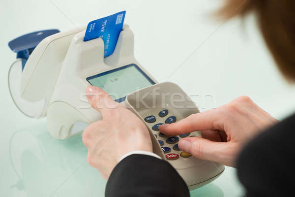 Woman Hand Using Credit Card Machine Stock photo © AndreyPopov