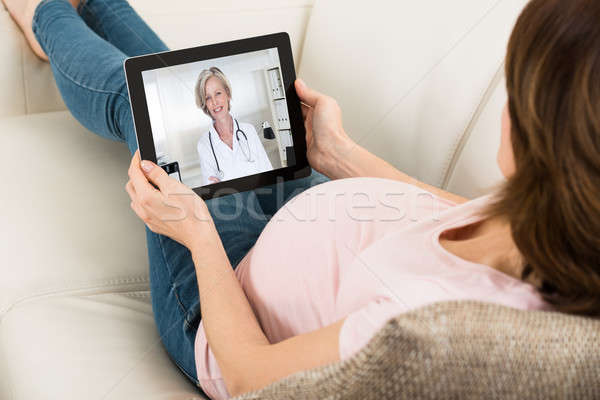 Expecting Woman Videoconferencing With Doctor Stock photo © AndreyPopov
