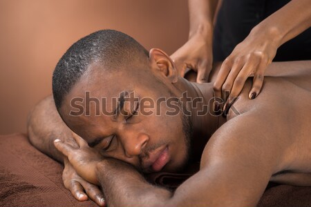 Mann Massage Behandlung glücklich african Stock foto © AndreyPopov