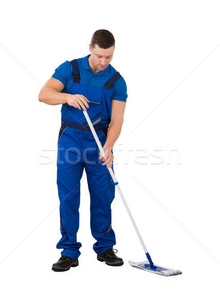 Male Janitor Cleaning Floor With Mop Stock photo © AndreyPopov