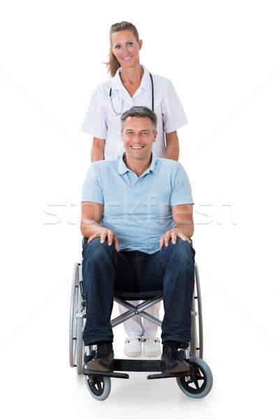 Foto stock: Feminino · médico · paciente · cadeira · de · rodas · retrato · deficientes