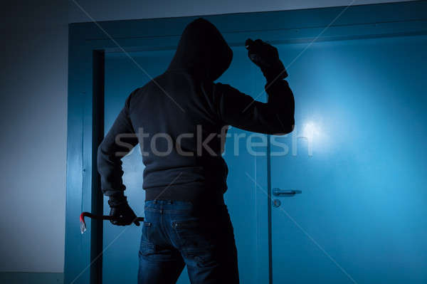 Thief Standing Outside The Door Stock photo © AndreyPopov