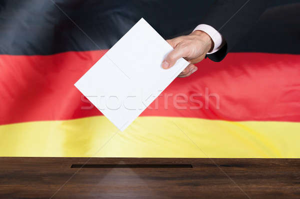 Person Putting Vote In A Ballot Box Stock photo © AndreyPopov