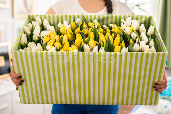 Woman Holding Tulips In The Box Stock photo © AndreyPopov