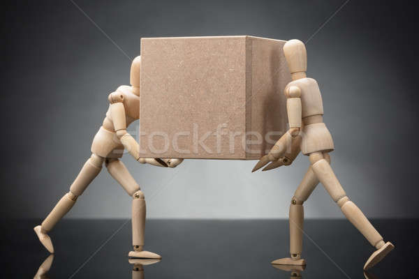 Wooden Dummy Couple Carrying Cardboard Box Stock photo © AndreyPopov