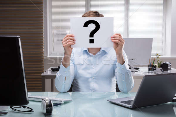 Businessperson Holding Placard With Question Mark Sign Stock photo © AndreyPopov