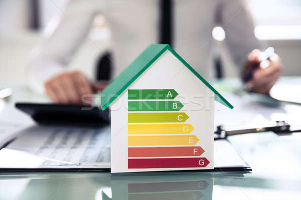 Close-up Of House Model Showing Energy Efficiency Rate Stock photo © AndreyPopov