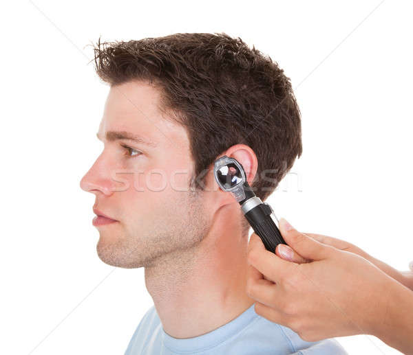 Doctor Examining Patient's Ear Stock photo © AndreyPopov