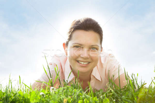 Young Woman Relaxing In Grassland Stock photo © AndreyPopov