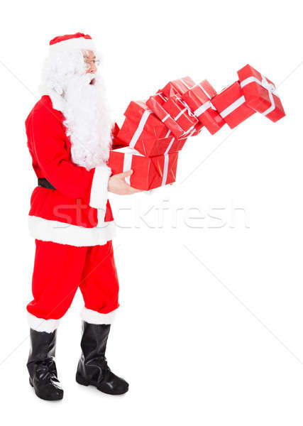 Portrait of santa holding stack of gift Stock photo © AndreyPopov