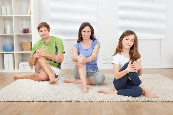 Smiling Family Performing Yoga On Rug Stock photo © AndreyPopov
