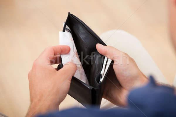 Broke Man Holding Wallet Stock photo © AndreyPopov