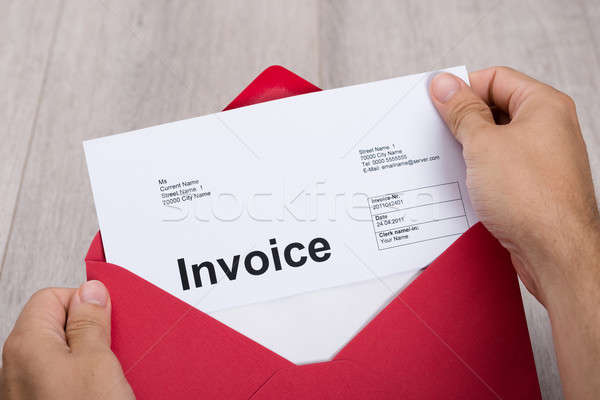 Hand Holding Invoice In Envelope Stock photo © AndreyPopov