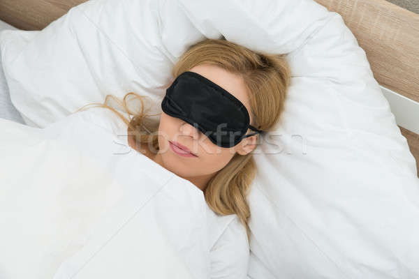 Woman Sleeping With Sleep Mask Stock photo © AndreyPopov