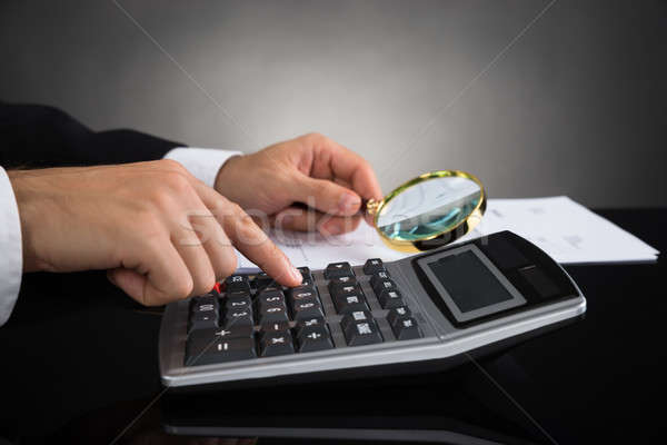 Businessperson Inspecting Invoice Stock photo © AndreyPopov