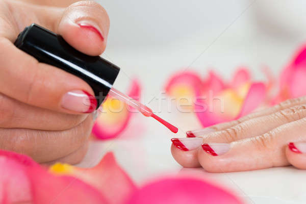 Female Hands Applying Nail Varnish Stock photo © AndreyPopov