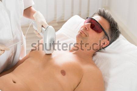 Woman Undergoing Laser Treatment At Salon Stock photo © AndreyPopov