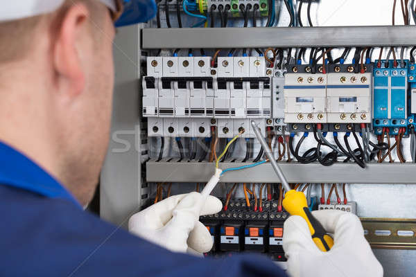 Male Technician Checking Fusebox Stock photo © AndreyPopov