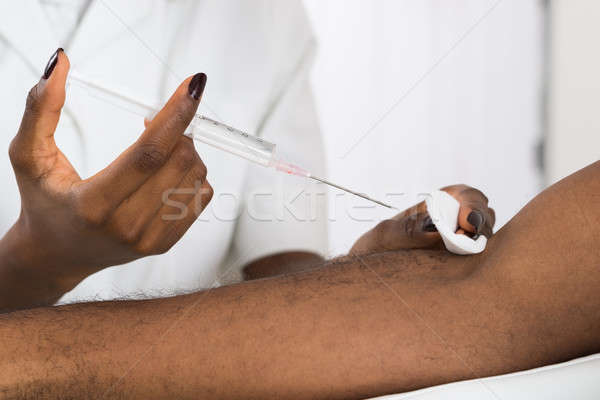 Oltás beteg közelkép orvosok kéz egészség Stock fotó © AndreyPopov