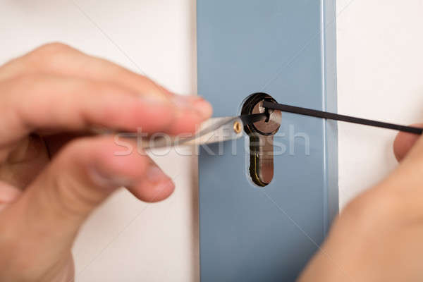 Lockpicker Opening Door Lock Stock photo © AndreyPopov