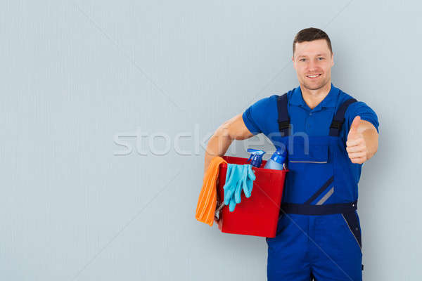 Male Janitor Carrying Cleaning Equipment Stock photo © AndreyPopov