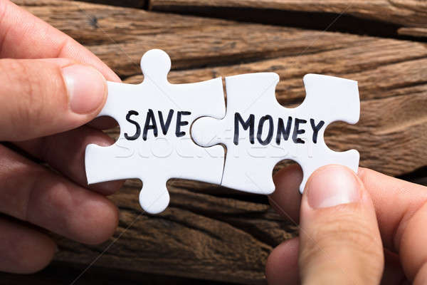 Hands Connecting Save Money Jigsaw Pieces Stock photo © AndreyPopov