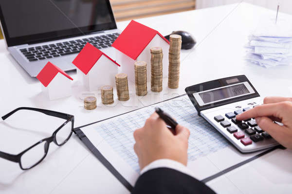 Businessperson Calculating Tax Stock photo © AndreyPopov