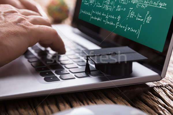 Student Solving Mathematical Problems On Laptop Stock photo © AndreyPopov