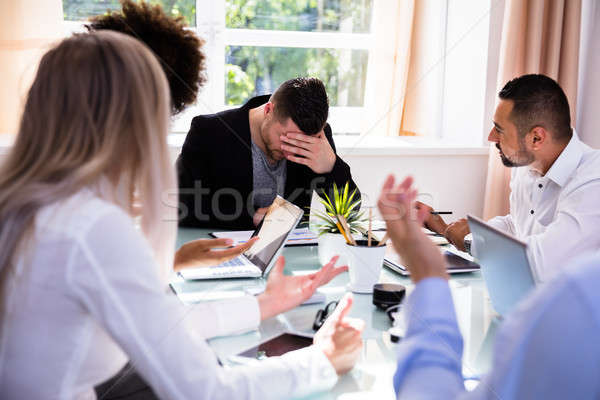 Businesspeople Blaming Their Colleague In Office Stock photo © AndreyPopov