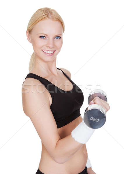 Fitnessz nő súlyzós edzés gyönyörű fiatal izolált fehér Stock fotó © AndreyPopov