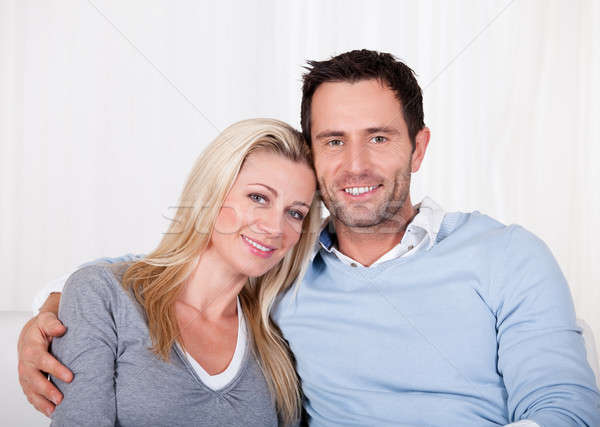 Affectionate couple relaxing on a sofa Stock photo © AndreyPopov