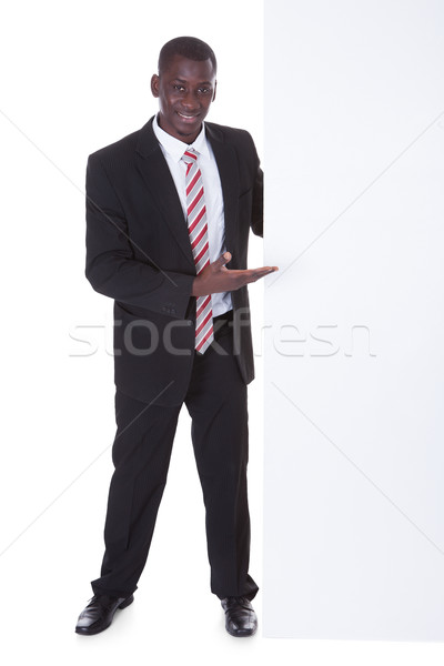 African Businessman Holding Placard Stock photo © AndreyPopov