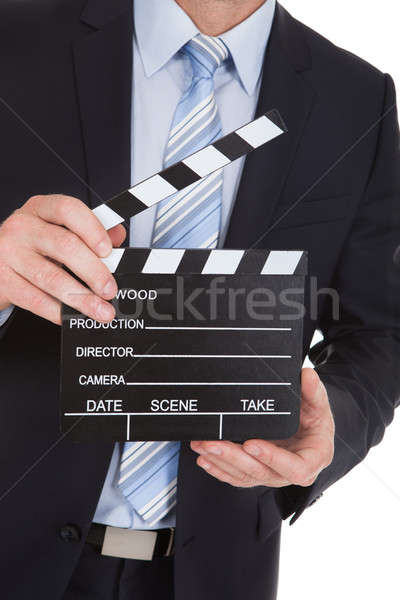 Businessman Holding Clapboard Stock photo © AndreyPopov