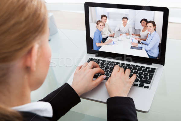 Businesswoman Chatting With Colleague Stock photo © AndreyPopov