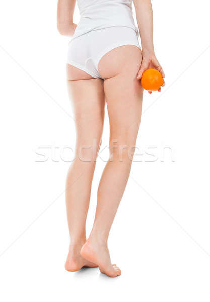 Low Section Of Woman Holding Orange Stock photo © AndreyPopov