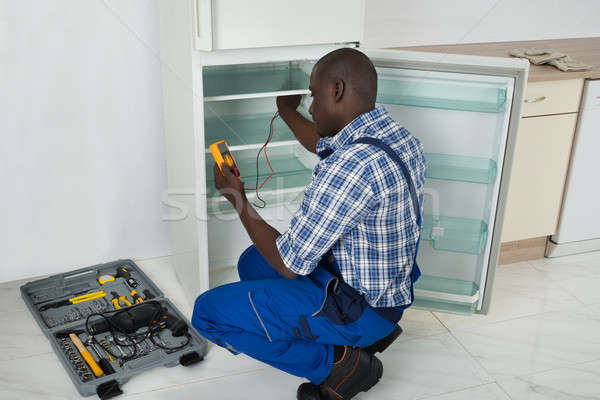 Technician Repairing Refrigerator Appliance Stock photo © AndreyPopov