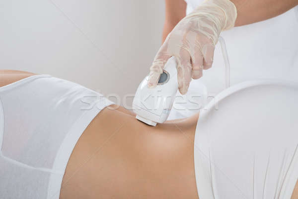 Nő epiláció lézer kezelés fiatal nő szépségközpont Stock fotó © AndreyPopov