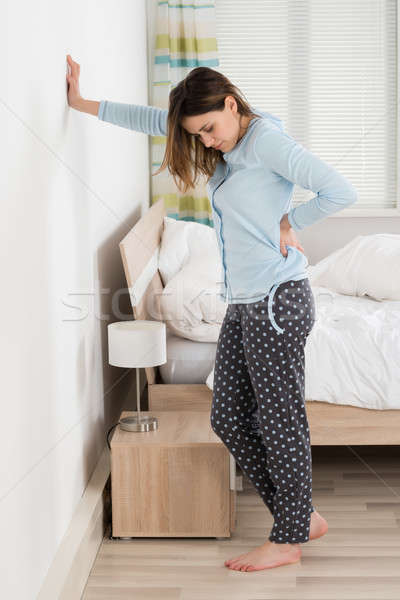 Young Woman Suffering From Back Pain Stock photo © AndreyPopov