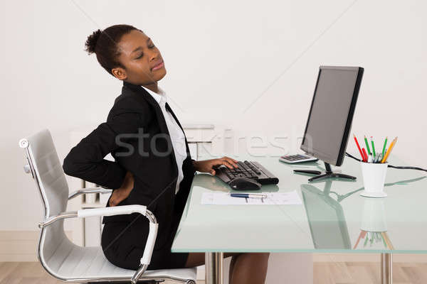 деловая женщина страдание боль в спине служба молодые африканских Сток-фото © AndreyPopov