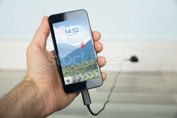 Person Charging His Mobilephone Stock photo © AndreyPopov