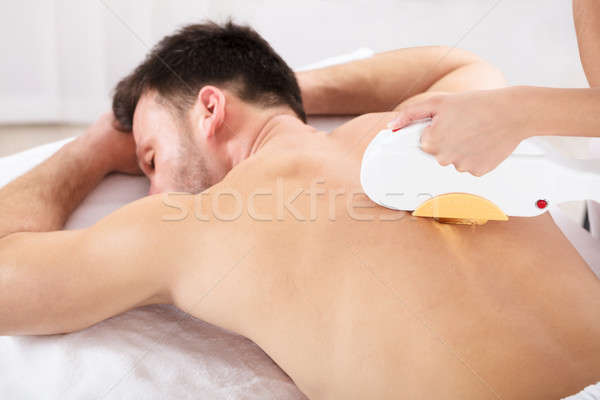 Man Having Laser Treatment At Beauty Clinic Stock photo © AndreyPopov