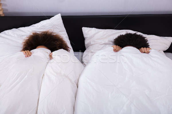 カップル 顔 白 シート 表示 ベッド ストックフォト © AndreyPopov