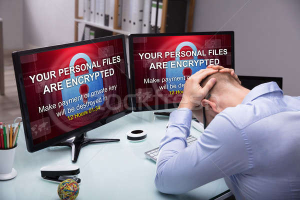 Stressed Businessman Sitting In Office Stock photo © AndreyPopov