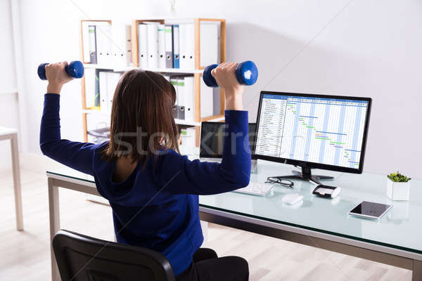 Stockfoto: Zakenvrouw · oefening · achteraanzicht · vrouw · werk