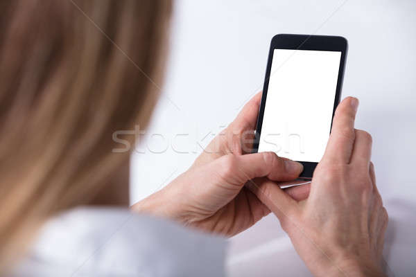 Ludzka ręka telefonu komórkowego biały ekranu kobieta strony Zdjęcia stock © AndreyPopov